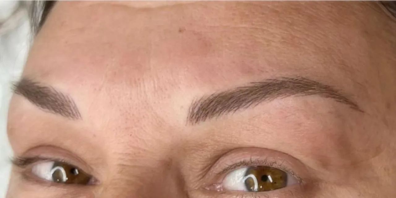 The same client after treatment, with full powder brows