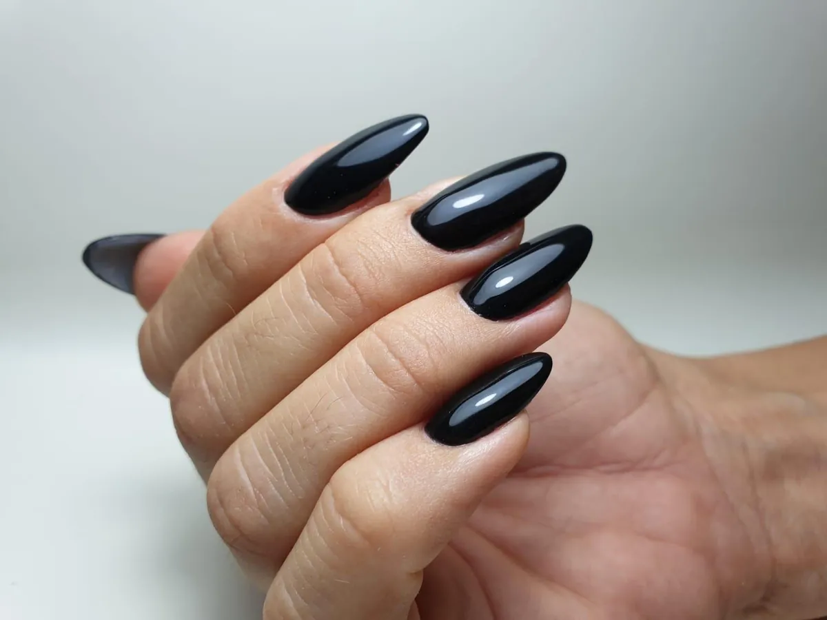 Glossy black almond nails